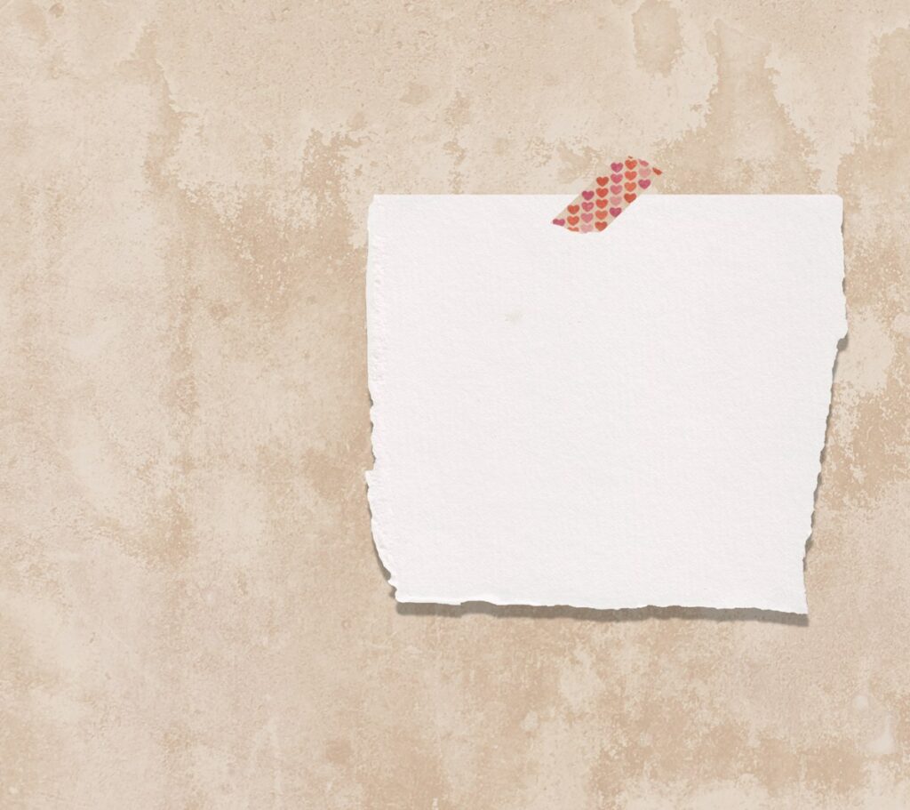 white printer paper on brown surface