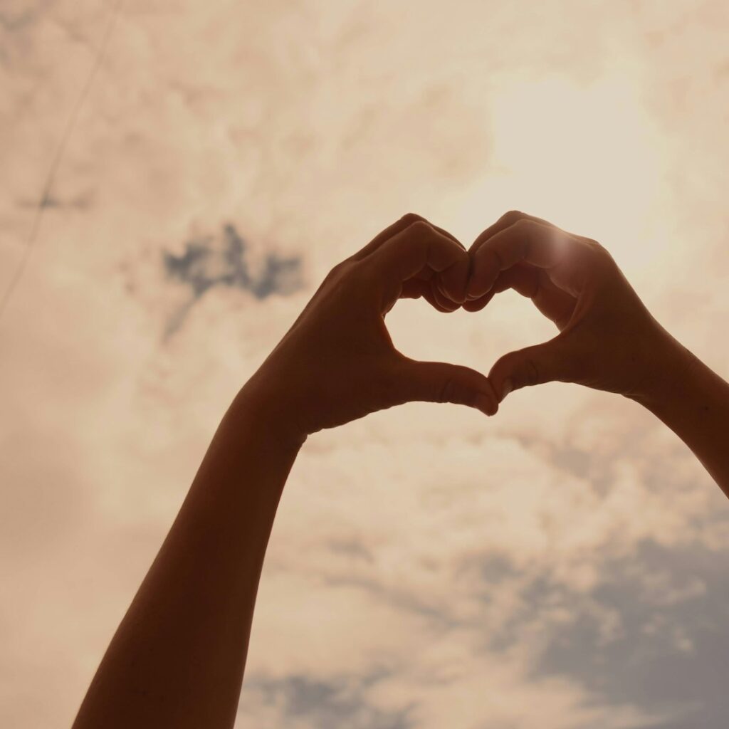 persons hand forming heart
